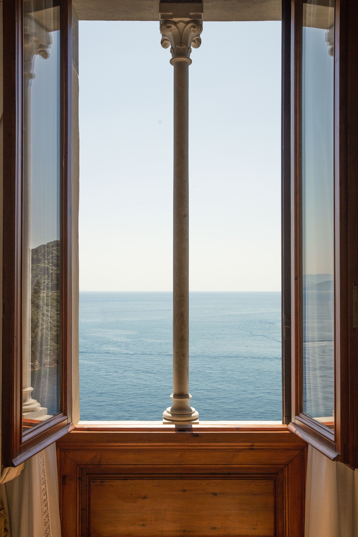 open windows from villa Beatrice with views over the Mediterranean