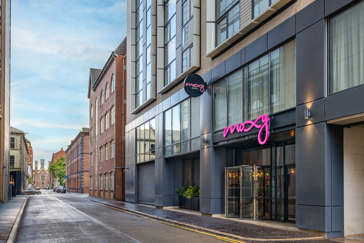 external street view of Moxy Belfast with pink neon moxy signage
