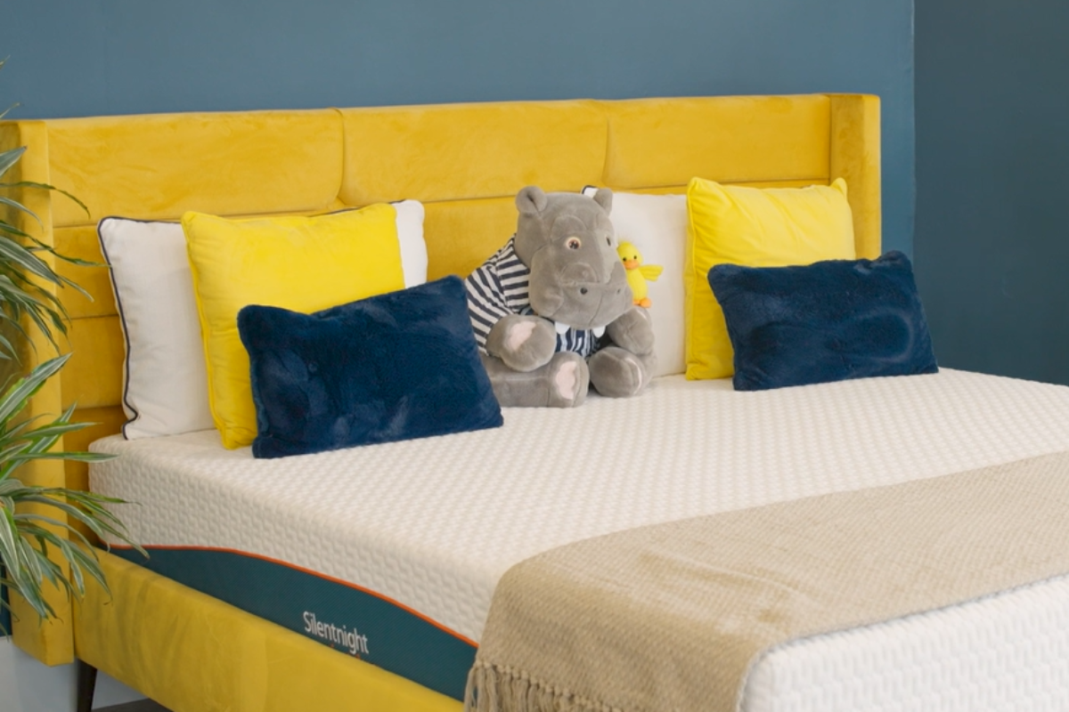Chartreuse headboard with Silentnight mattress and hippo teddy