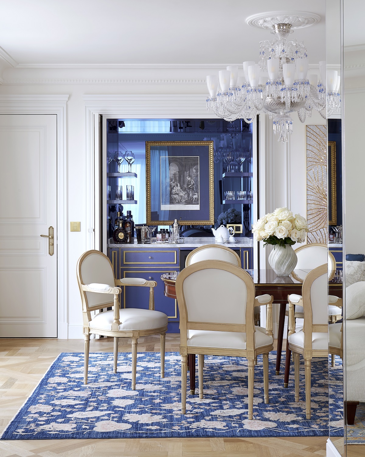 white period style chairs around table in front of bar