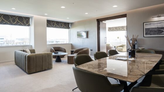 dining table, couch and seating from BoConcept in hotel room with skyline views