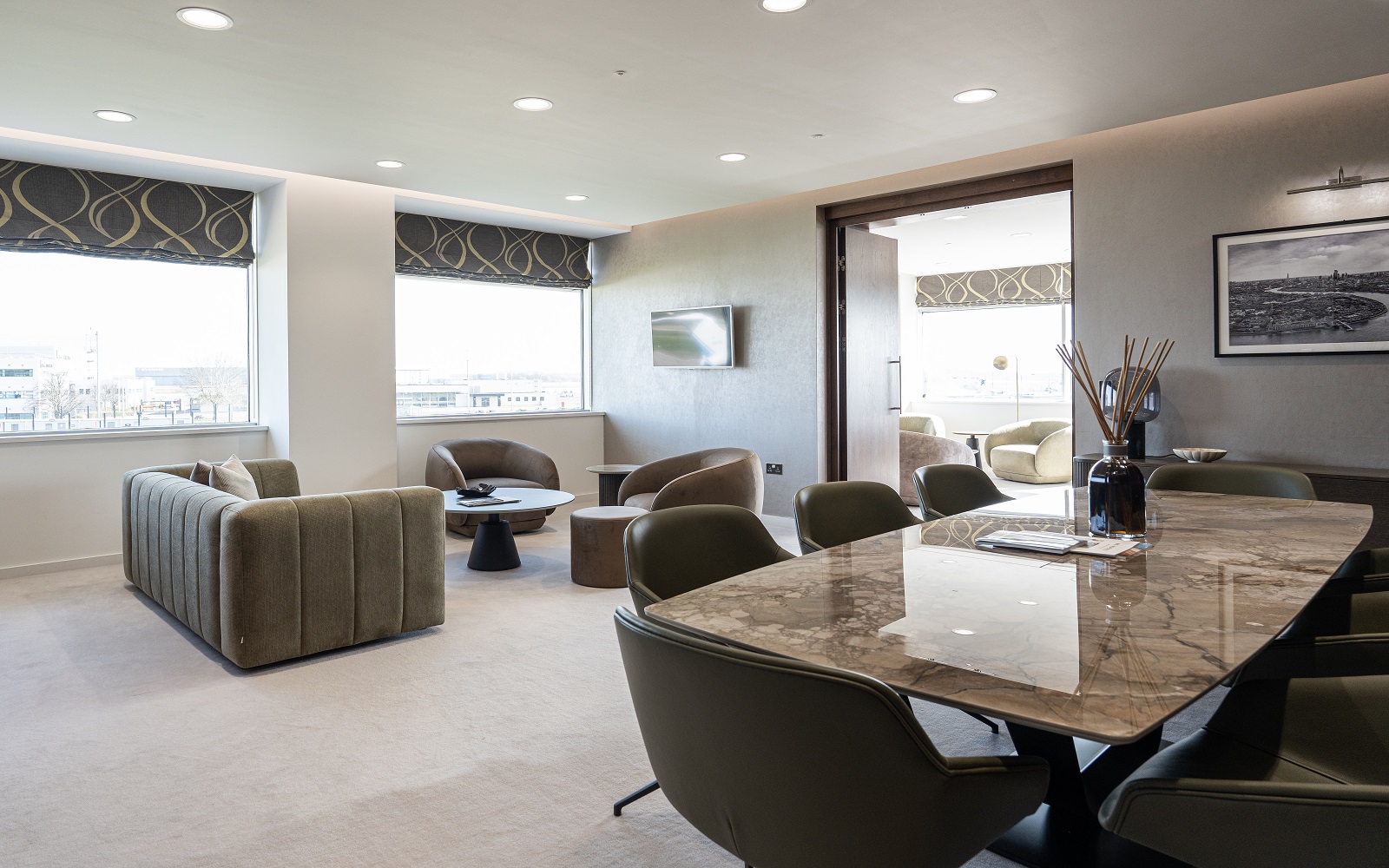 dining table, couch and seating from BoConcept in hotel room with skyline views