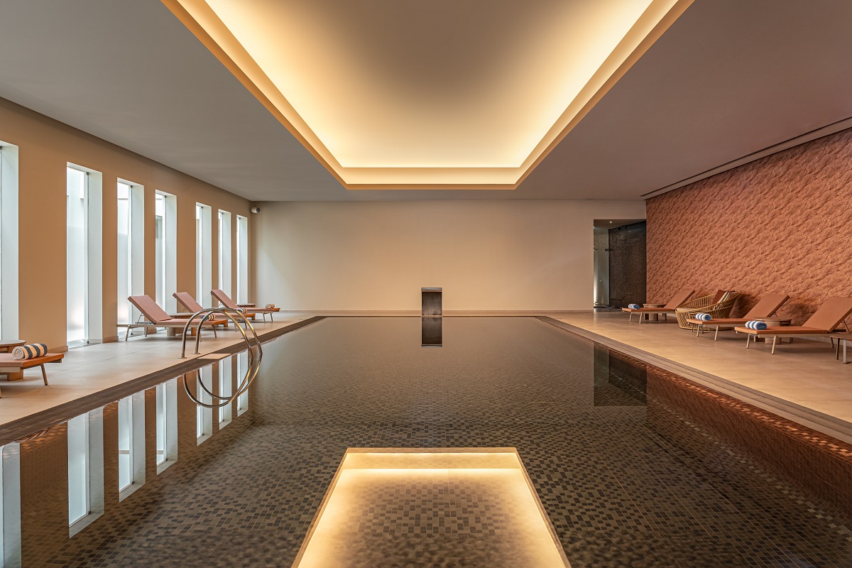 indoor spa swimming pool with architectural lighting above