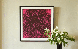 Pink and black graphic Richard Allan London silk scarf framed in black
