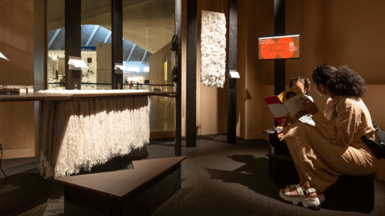 Woman and child reading book at The Design Museum London