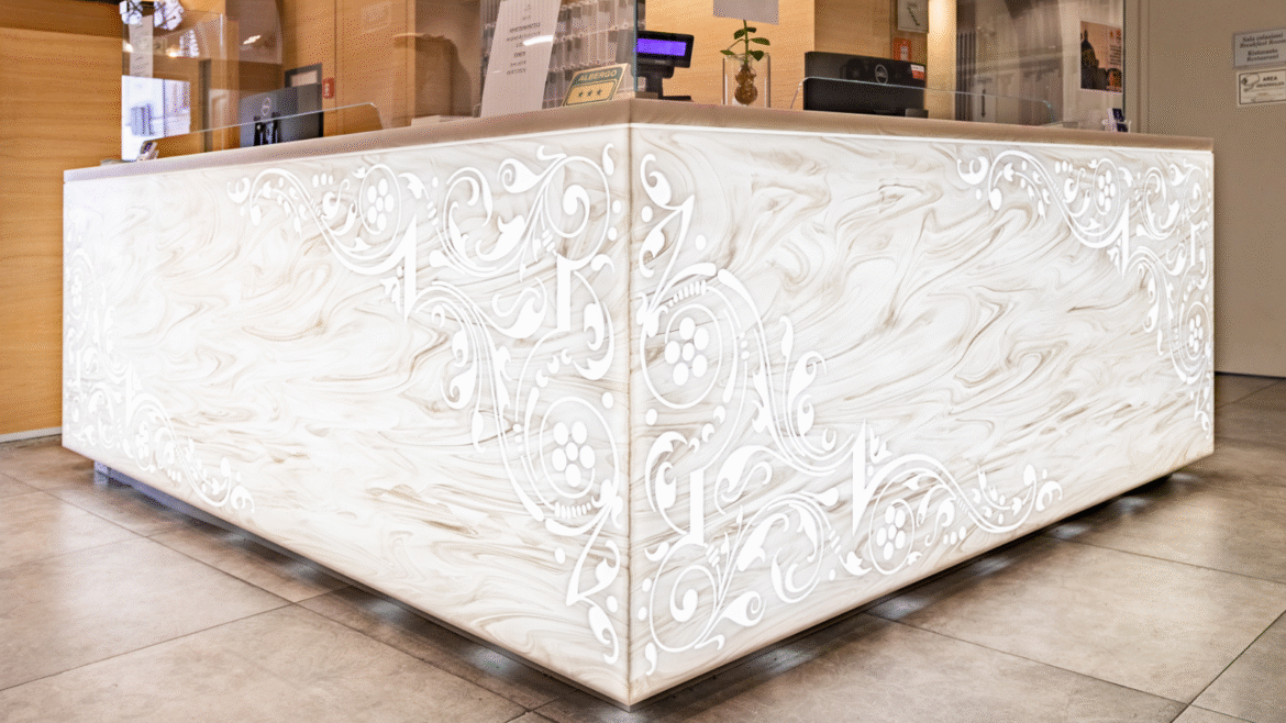 Corian reception desk, carved and backlit