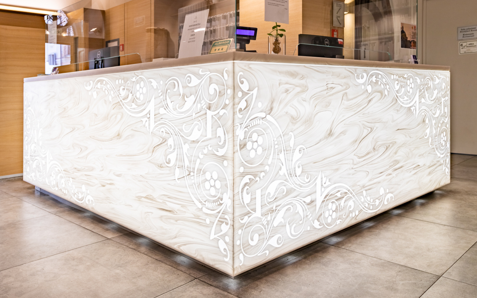 Corian reception desk, carved and backlit