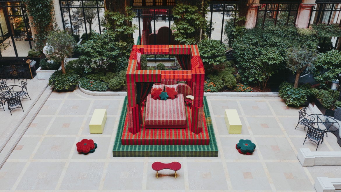 Raised on a platform and framed by bold red and green pillars, the ‘Day Bed’ structure feels at once playful and monumental. A fusion of sharp lines and organic shapes, the installation is industrial yet sumptuous. Low stools and benches in bright, Crayola hues are scattered across the tiled courtyard, inviting visitors to pause and take in the scene. With its bold palette of Plaza red and garden green, Uchronia has transformed the Hôtel Plaza Athénée courtyard space into a contemporary cubist exhibition, where – like a strange dream – a geometric bed awaits sleep outside, encased within the white walls of historic Paris.