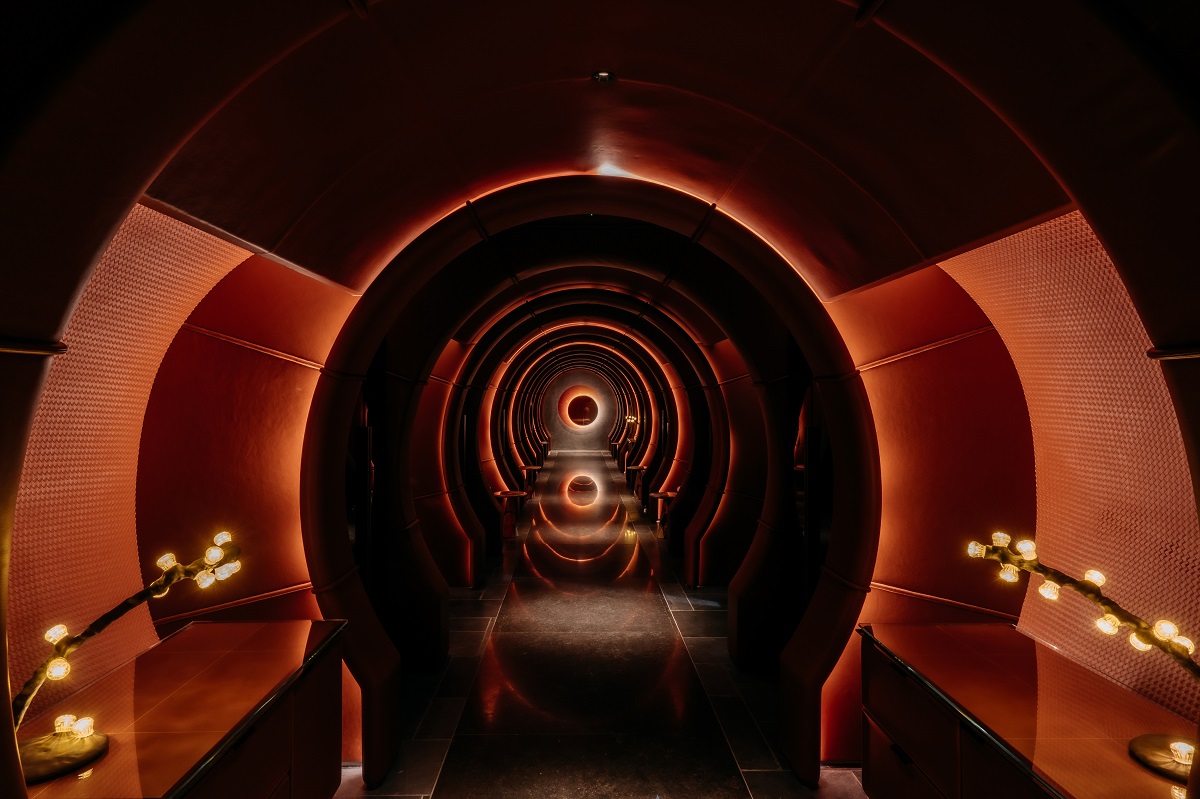 dark and moody passageway through arches into restaurant Le Pristine in Singapore