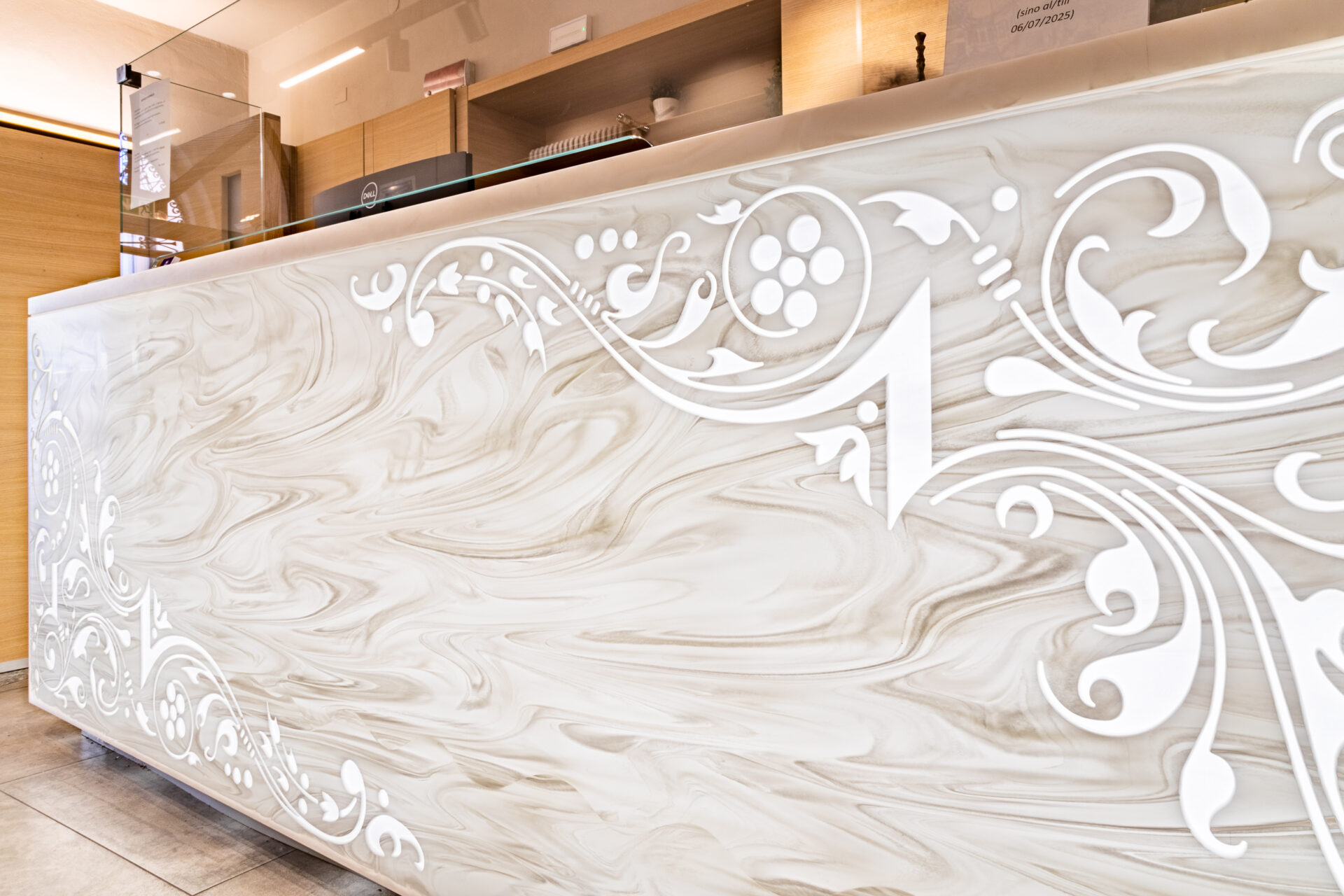 Carved bas-relief Corian design with LED backlighting