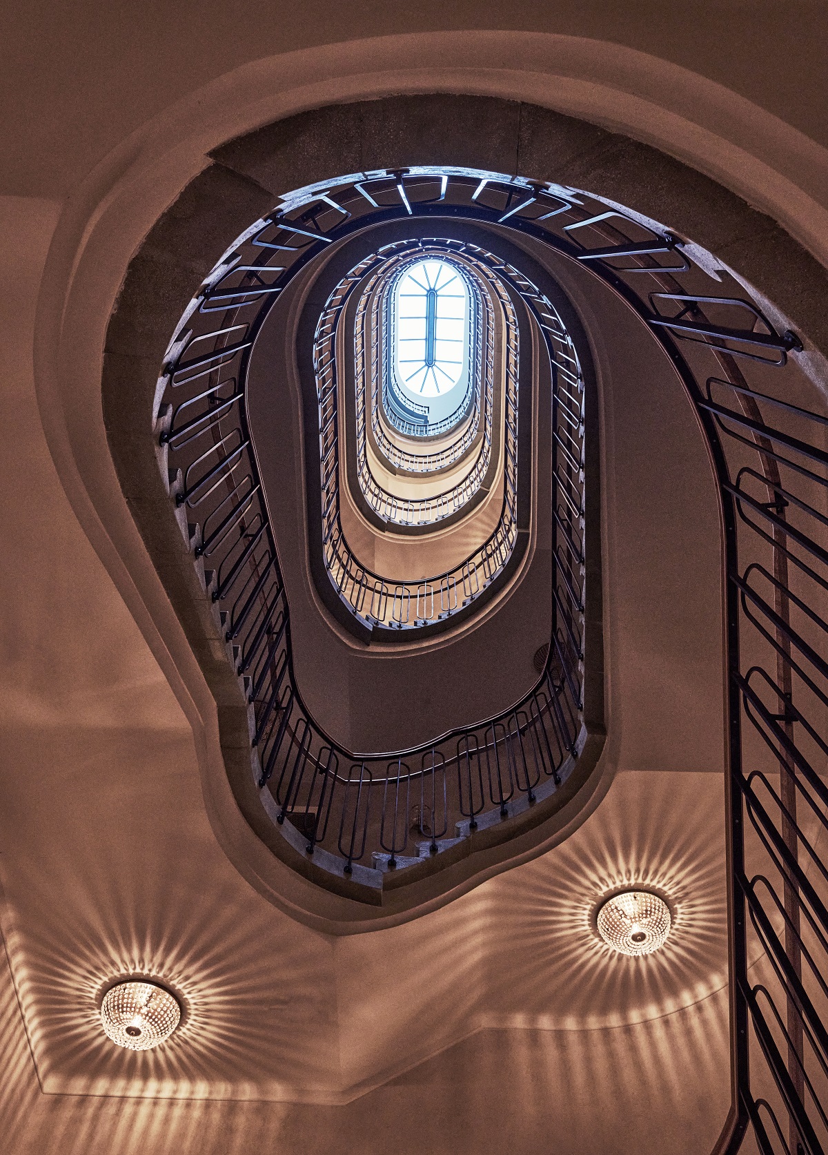 view looking up from Hotel Motto LobbyReception up into the stairwell