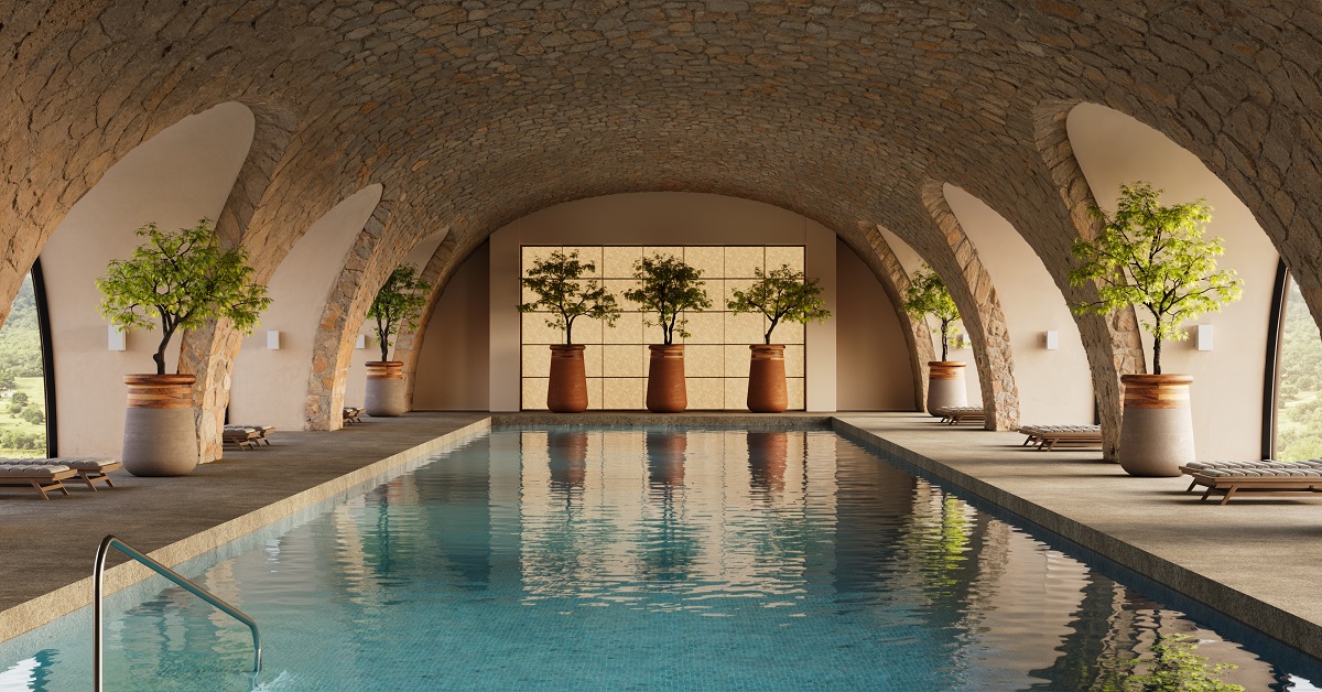 INDOOR SWIMMING POOL UNDER ARCHED ROOF WITH TERRACOTTA PLANTERS FROM INDIGENUS