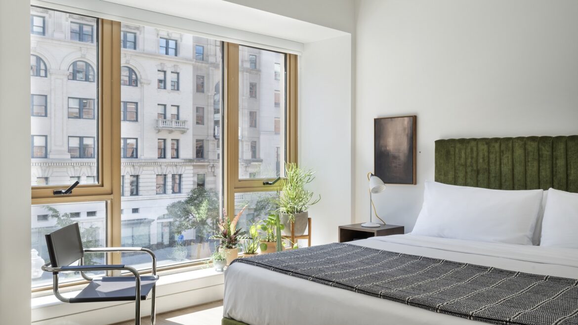 view from bed in aparthotel ROOST Washington DC with city view