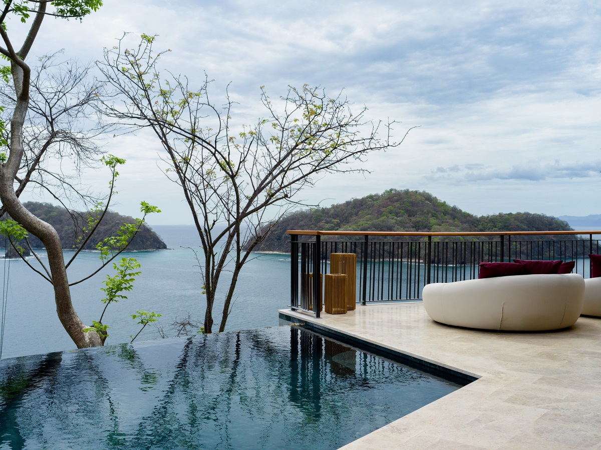 organic seating, stone floor and infinity pool overlooking the ocean view