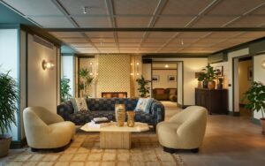 tub chairs and sofa around coffee table in The Cover Vienna
