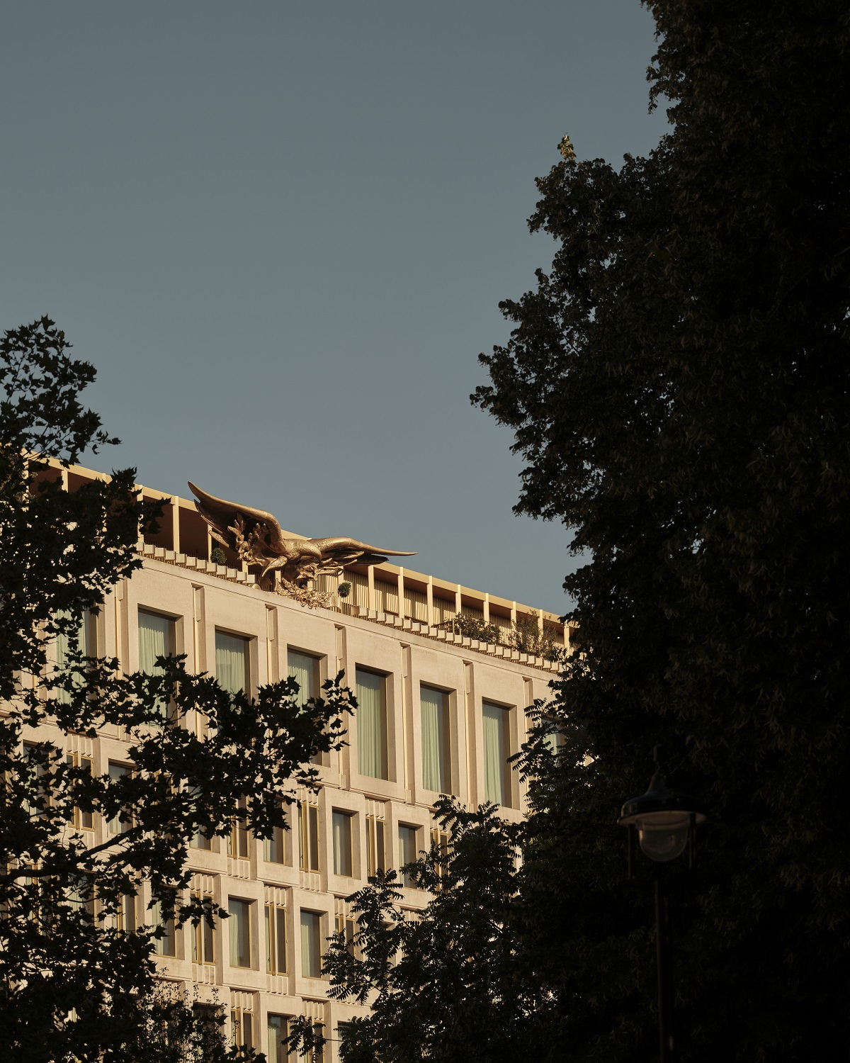 facade through trees of The Chancery Rosewood
