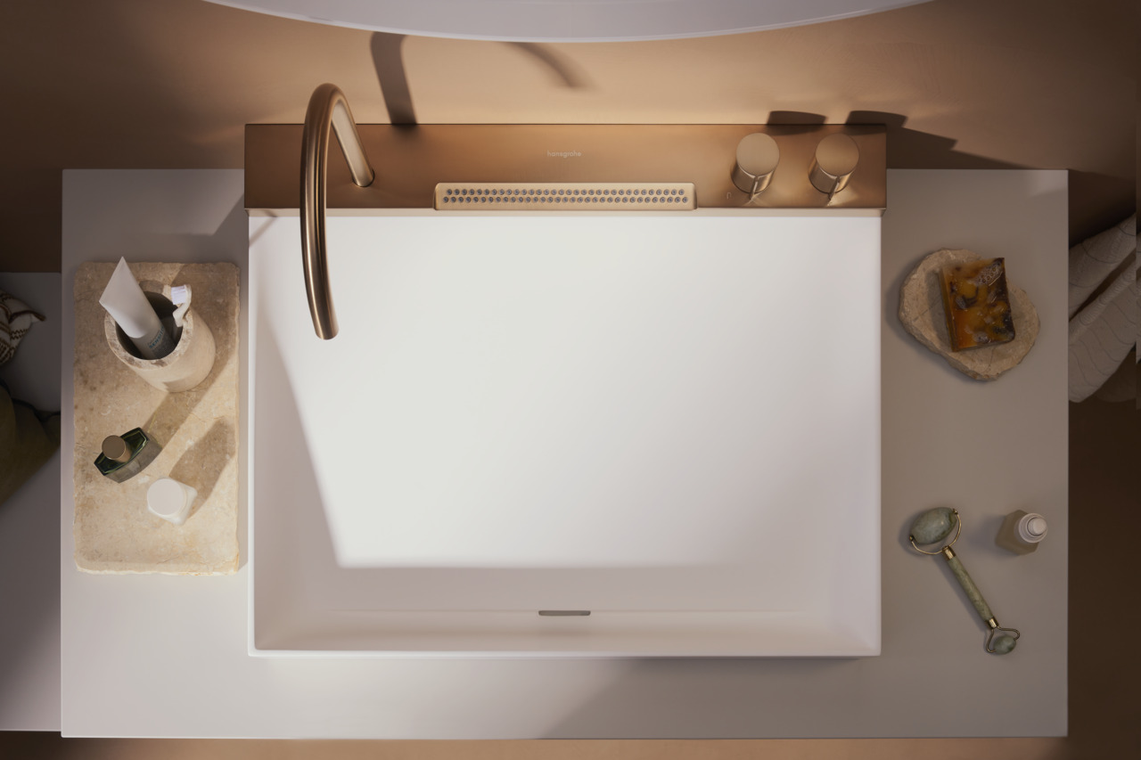 Birds eye view of Avalegra washbasin and tap combi product. White washbasin with gold/brass hardware