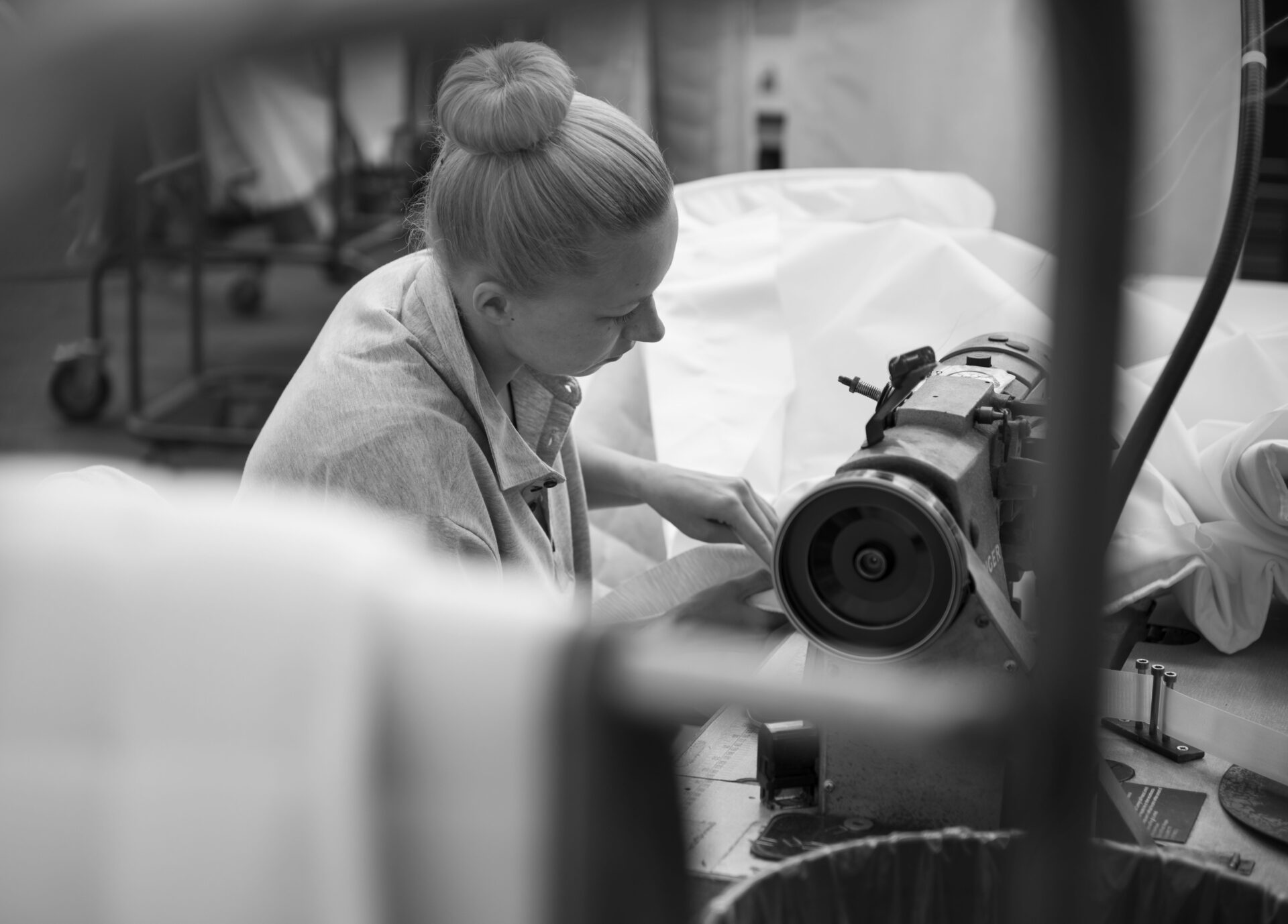 Lady stitching mattress in Silentnight factory
