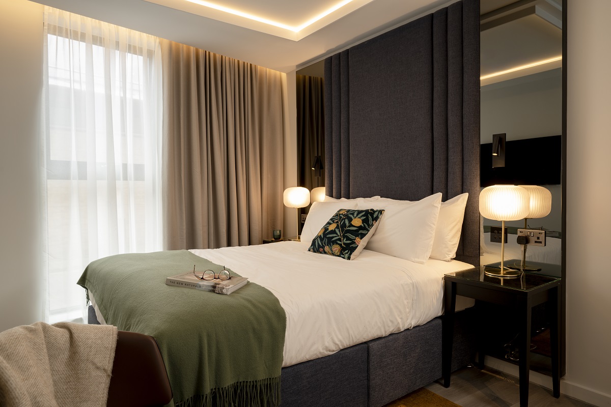 grey, cream and white interior of guestroom in aparthotel The Hobson