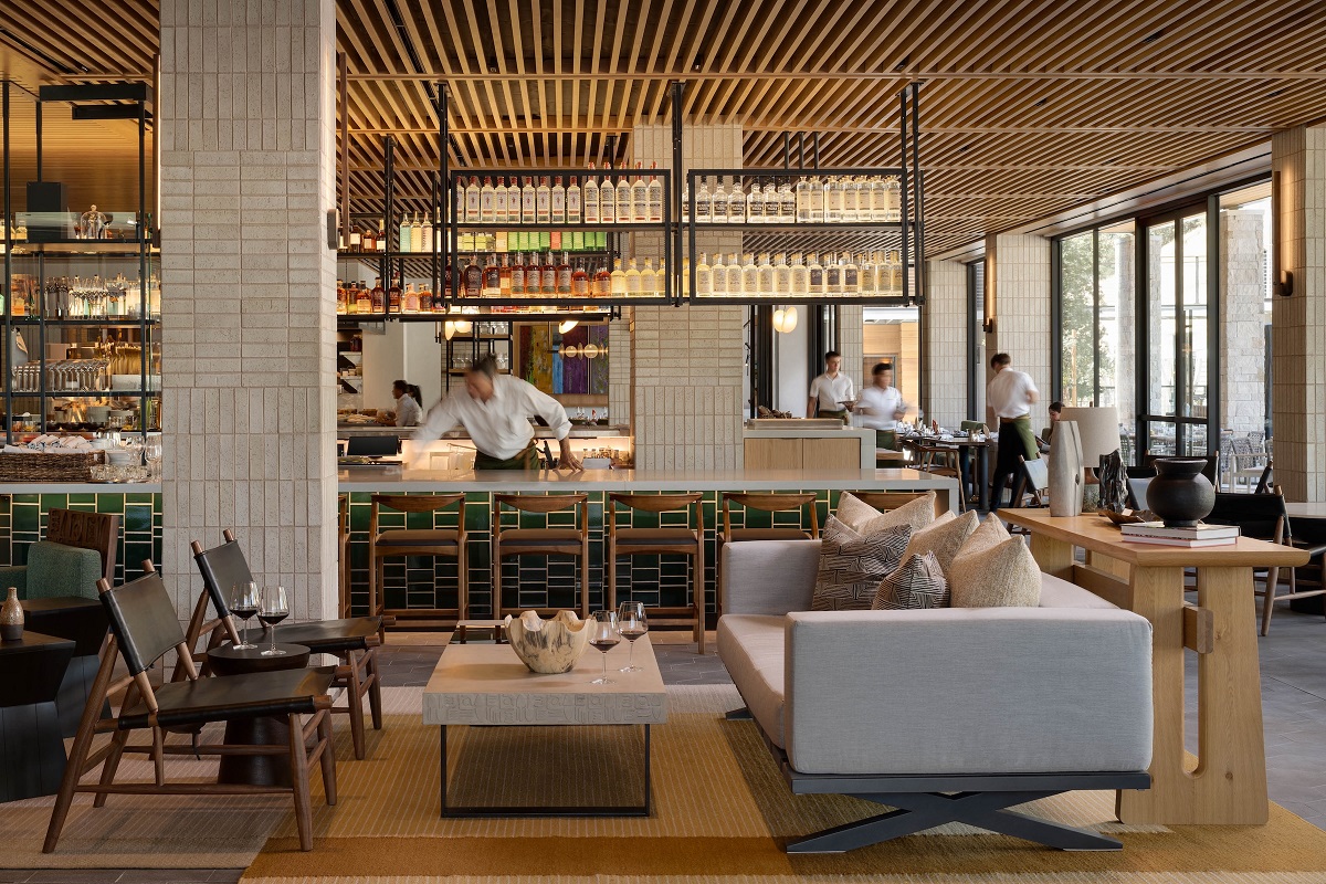 couch and seating in front of bar area and restaurant