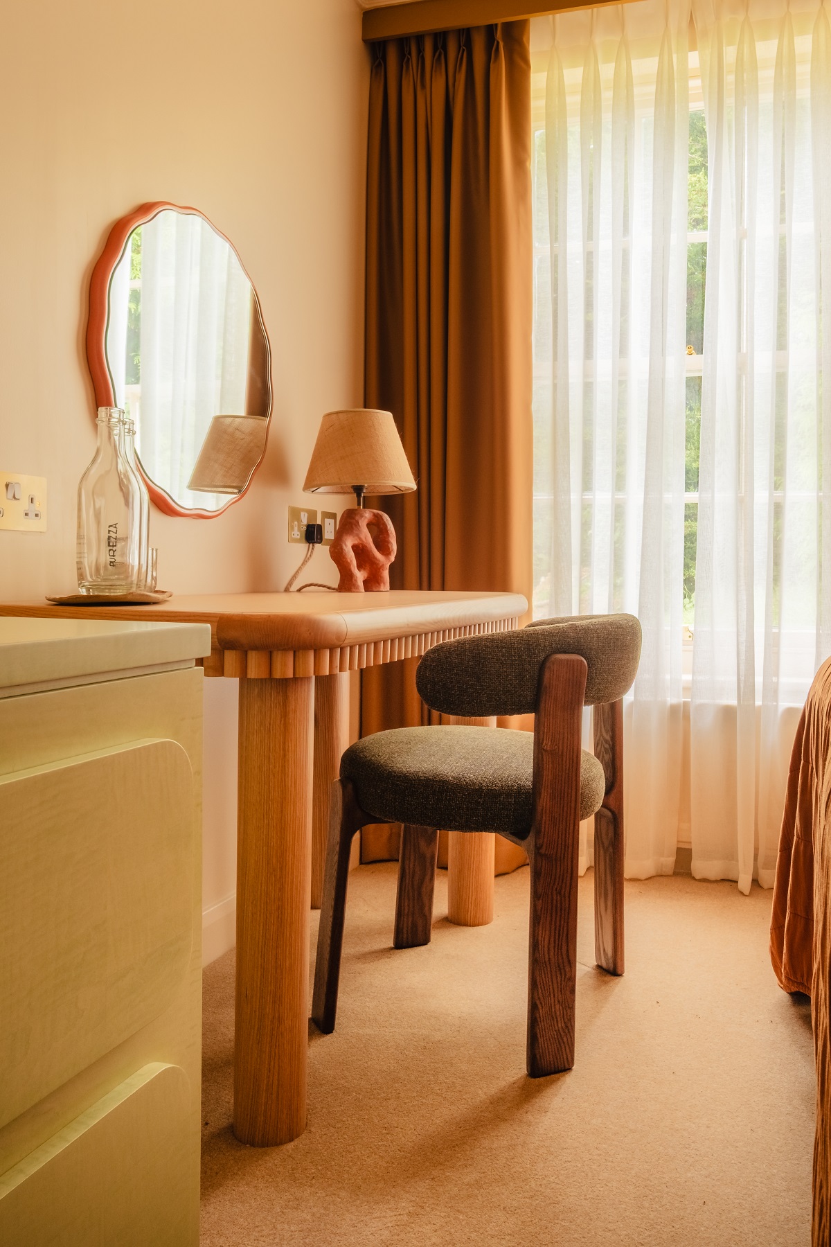 desk and vanity detail in guestroom with hand crafted details