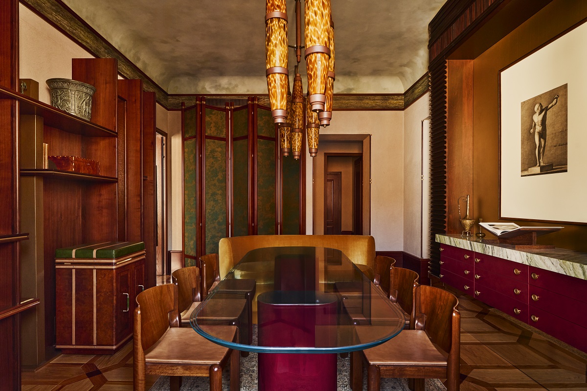 wooden panelling and glass table in dining area of Obelisco suite Orient Express La Minerva