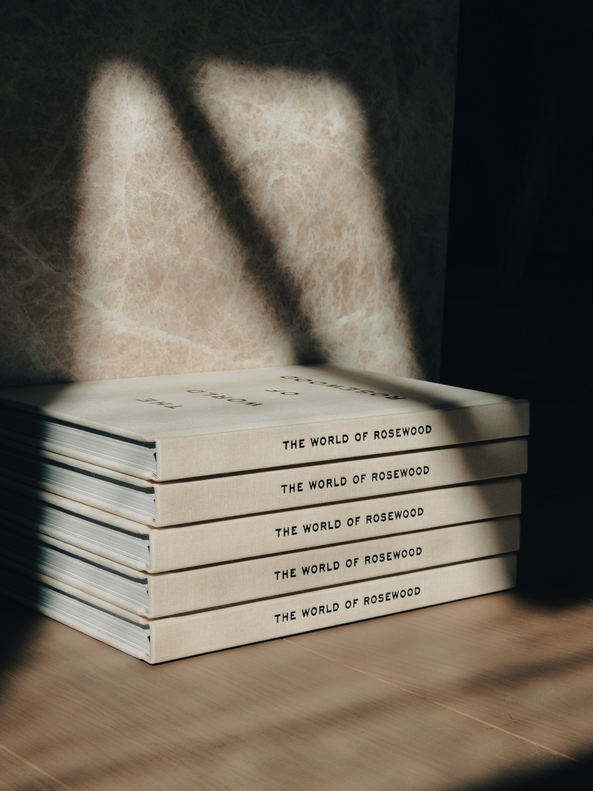 a monochromatic pile of Rosewood branded books