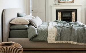 Halstock bed from Naturalmat covered in new upholstery fabric ReNew in oat colour.