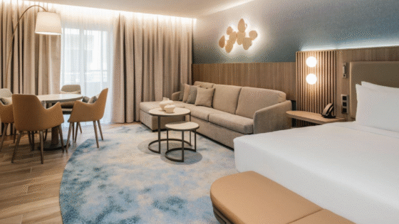 Organically shaped custom rug in Hotel Sliema guest room, designed by Studio Fabris and produced with Axminster weaving technique