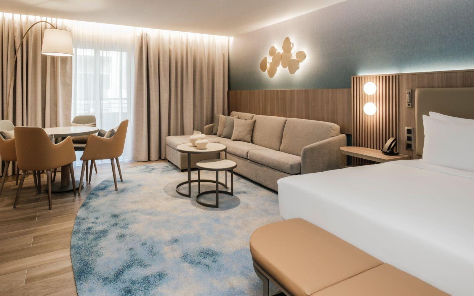 Organically shaped custom rug in Hotel Sliema guest room, designed by Studio Fabris and produced with Axminster weaving technique