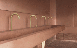 ABI Interiors brass taps in pink terracotta bathroom