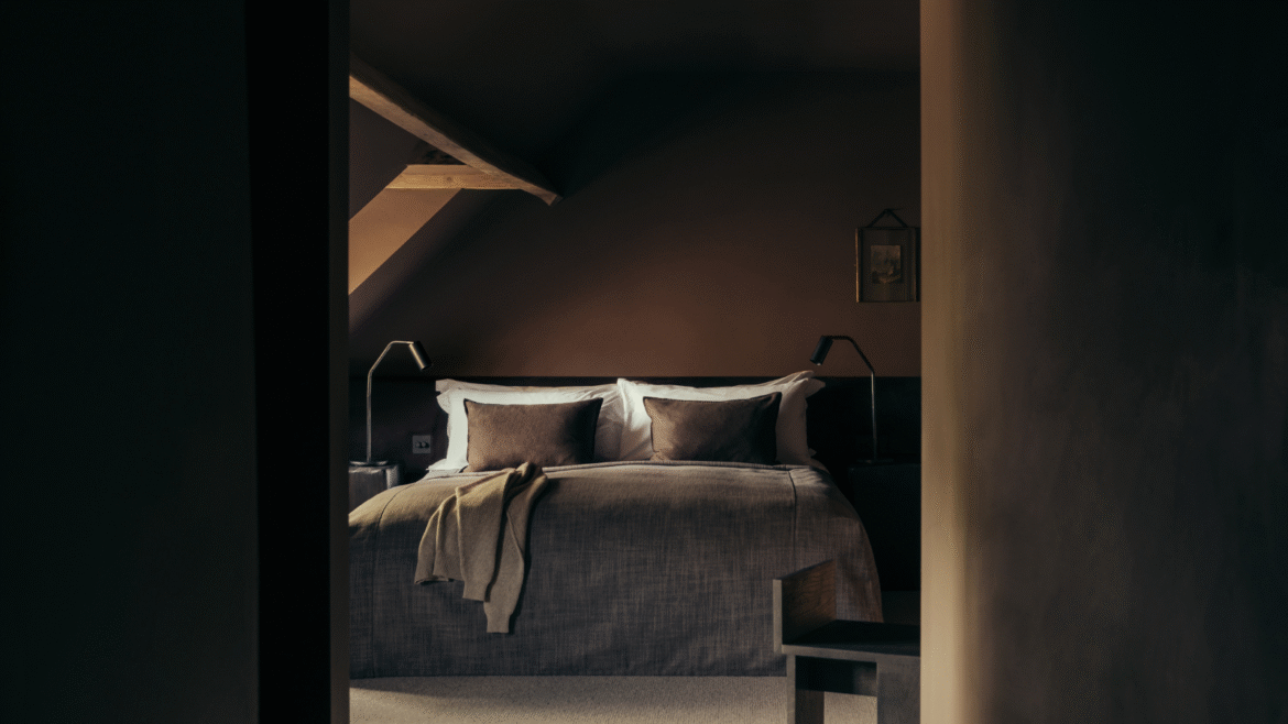 Dark brown painted bedroom with curved ceiling