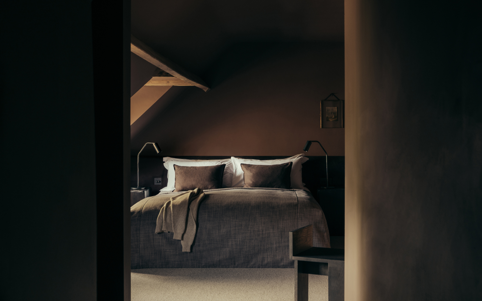 Dark brown painted bedroom with curved ceiling