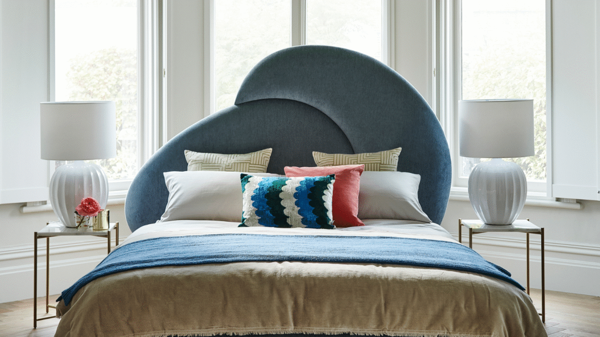 Curved frame navy velvet headboard on sofa.com bed