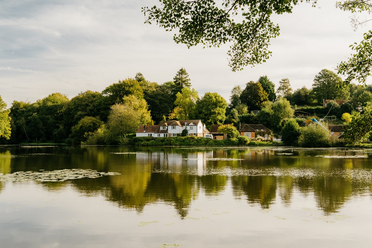 view across lake to hotel buildings at Crafted