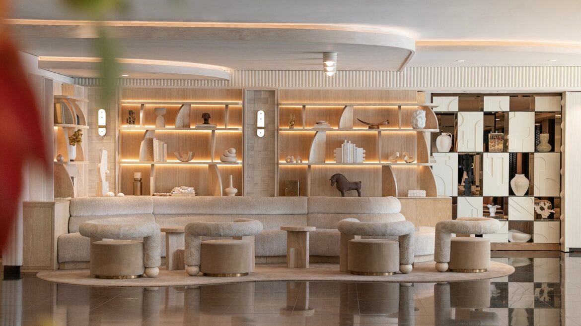 round tub seating in front of shelving display in wood and white in hotel lobby Sofitel Los Angeles at Beverly Hills