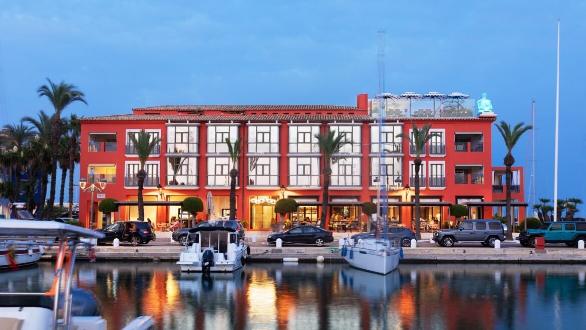 hotel facade with boats and harbour lights at MiM Sotogrande