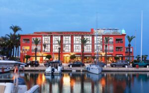 hotel facade with boats and harbour lights at MiM Sotogrande