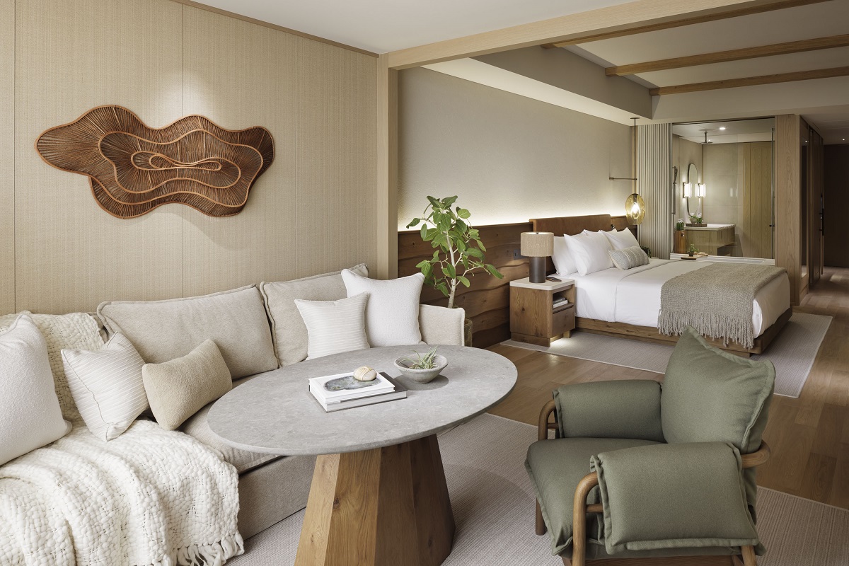 seating area in guestroom in 1 Hotel tokyo with textures throws and wallcoverings in natural colours