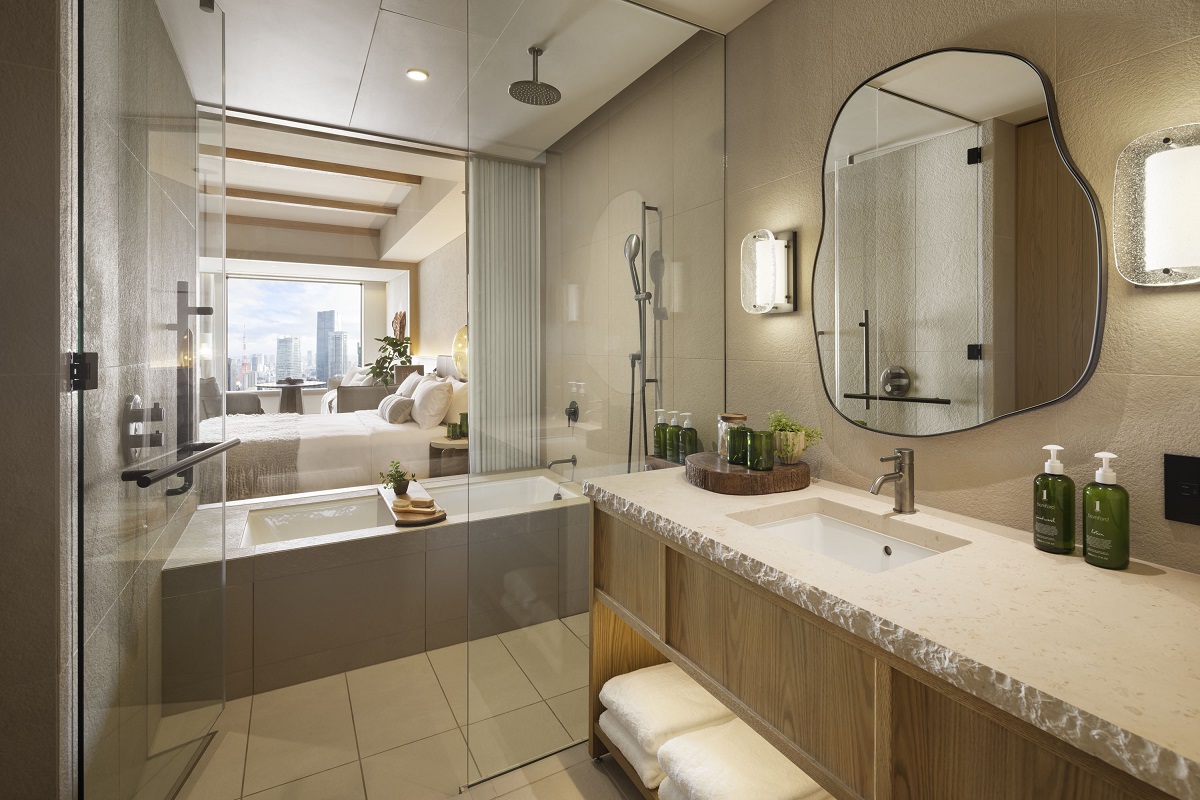 bathroom with views through guestroom to view of Tokyo skyline