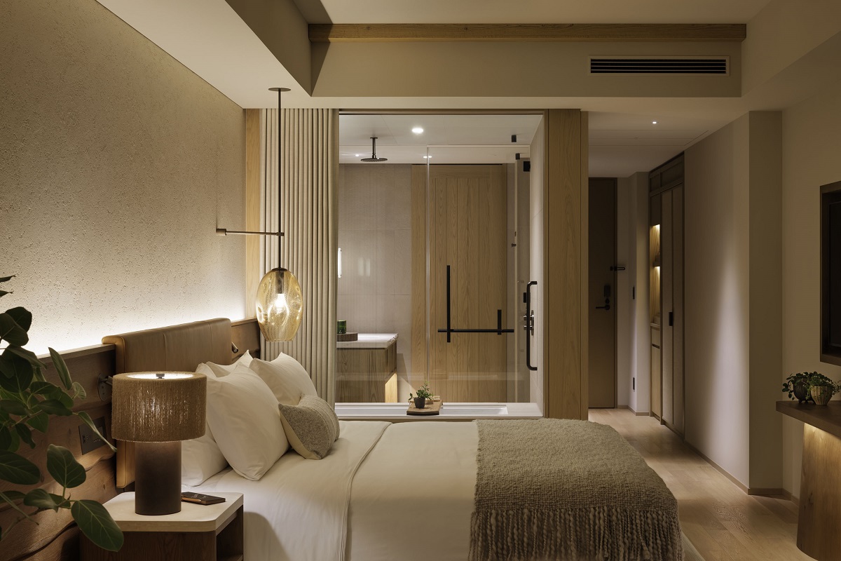bedroom in 1 Hotel Tokyo with view into bathroom with glass wall