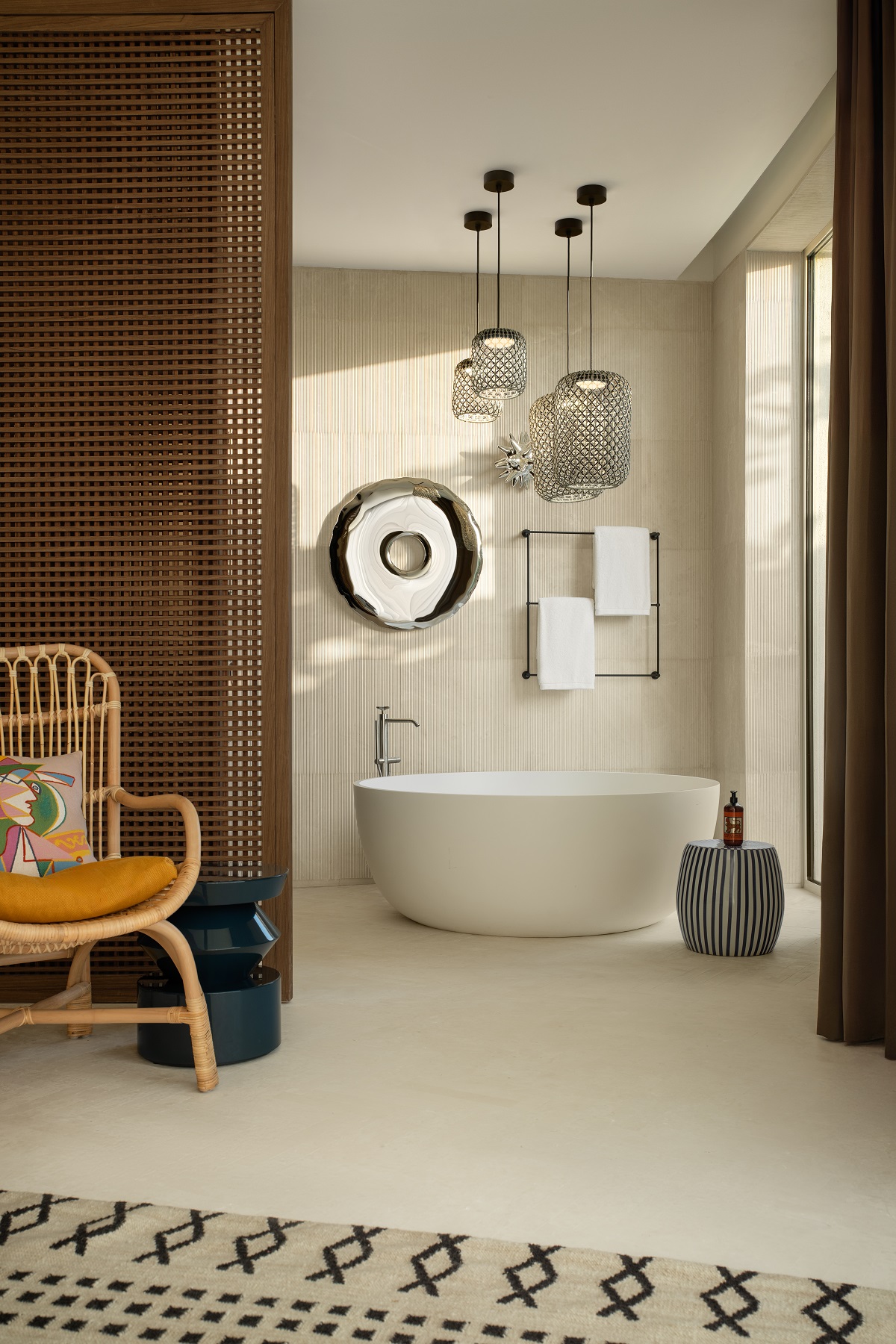 view into bathroom with freestanding bath and feature lights above the bath