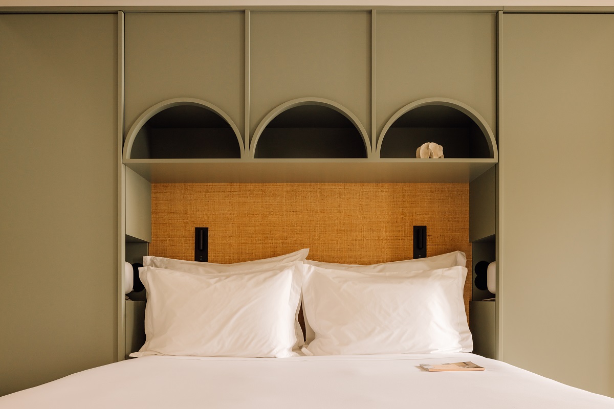 bed built in to olive green alcove