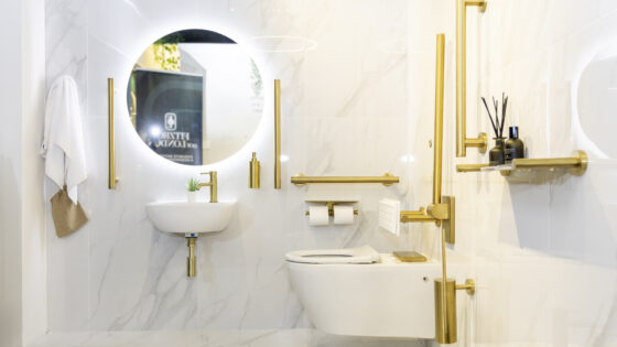 White marble bathroom with gold metal accents