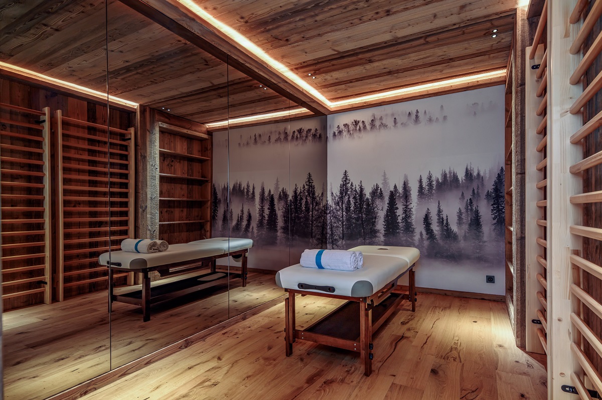 wooden floor, walls and ceiling in massage and spa room of purple ski chalet