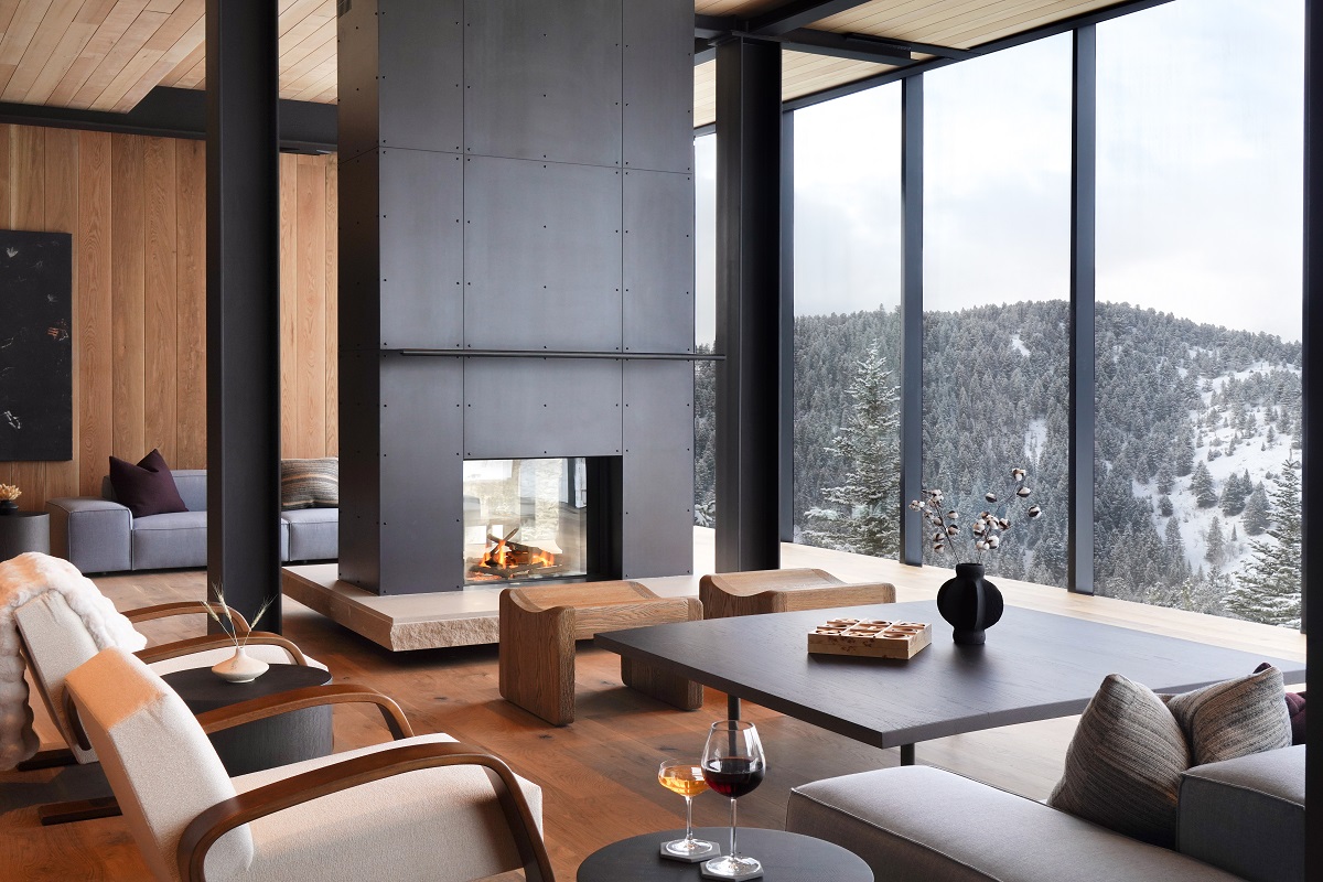 floor to ceiling window looking onto snowy mountains at One&Only Moonlight Basin