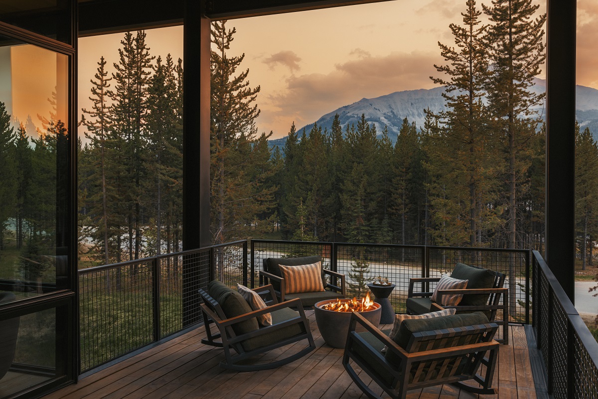 chairs on outdoor terrace around firepit in Montana mountains