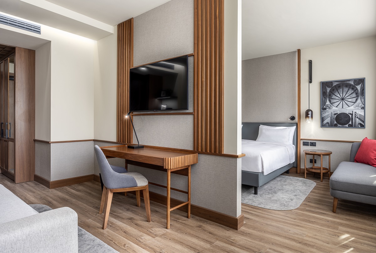 view from guestroom entrance with desk through to bedroom