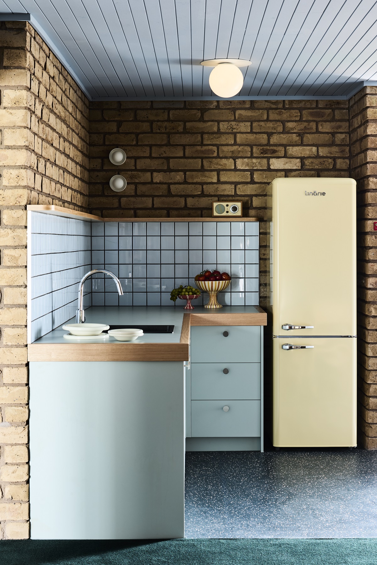 motel kitchen in cream and blue mid century style