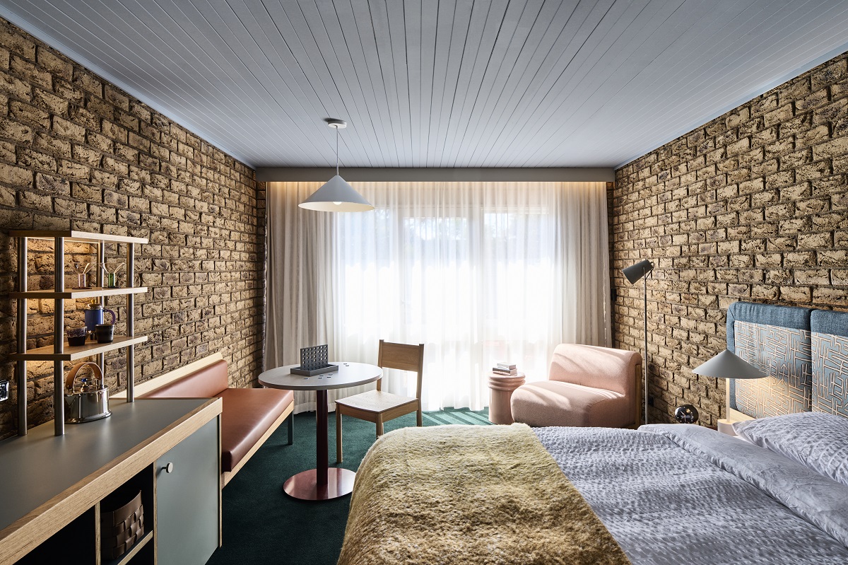 guestroom in Motel flinders with brick walls and pastel colour details